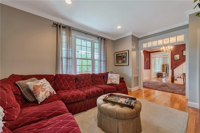 32 Old Chester Rd, Goshen, NY 10924 - living room featuring a chandelier, light wood-style floors, crown molding, recessed lighting, and stairway