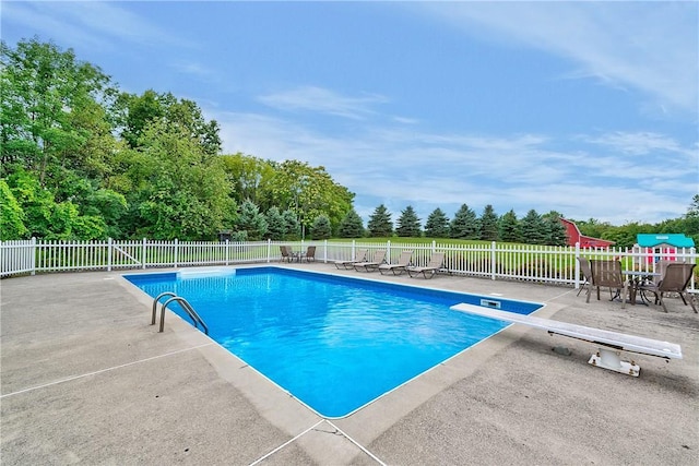 32 Old Chester Rd, Goshen, NY 10924 - view of swimming pool featuring a diving board, a patio area, and view of scattered trees
