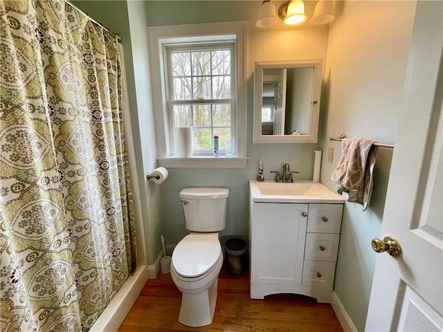 32 Old Chester Rd, Goshen, NY 10924 - full bath featuring wood finished floors, toilet, baseboards, and vanity