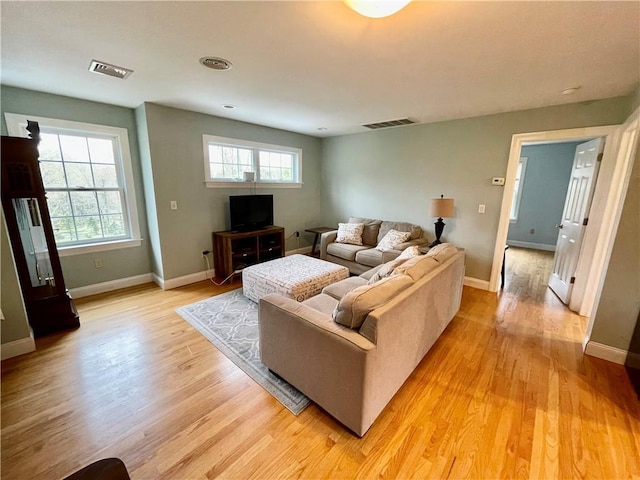 32 Old Chester Rd, Goshen, NY 10924 - living area featuring light wood finished floors, healthy amount of natural light, and baseboards