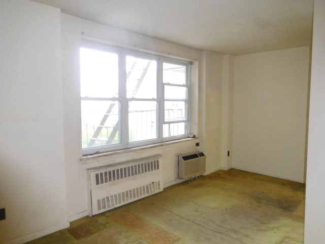 377 N Broadway Unit 601, Yonkers, NY 10701 - spare room featuring radiator and a wall mounted AC