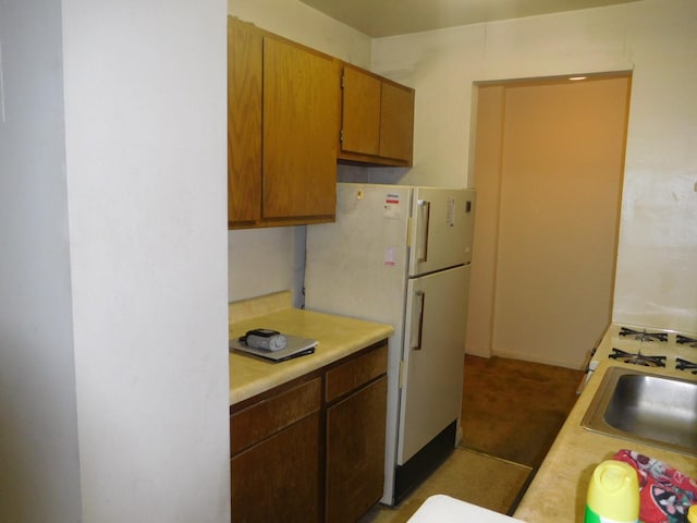 377 N Broadway Unit 601, Yonkers, NY 10701 - kitchen with light countertops, freestanding refrigerator, and a sink