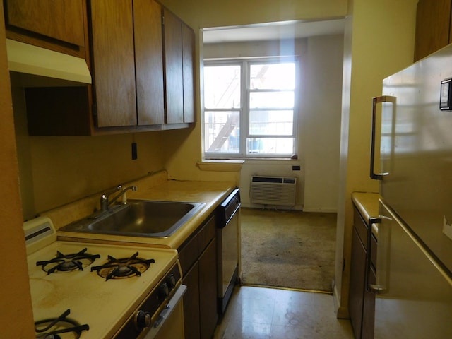 377 N Broadway Unit 601, Yonkers, NY 10701 - kitchen featuring white range with gas stovetop, freestanding refrigerator, a sink, a wall mounted AC, and light carpet