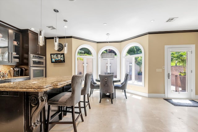 142-30 13th Ave, Malba, NY 11357 - kitchen featuring stainless steel double oven, baseboards, light stone countertops, glass insert cabinets, and hanging light fixtures