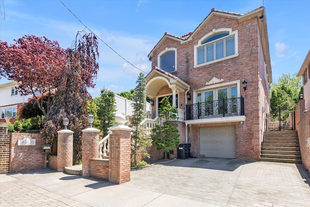 142-30 13th Ave, Malba, NY 11357 - view of front of property with decorative driveway, brick siding, a garage, and stairway