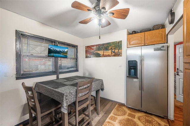 13538 129th St, South Ozone Park, NY 11420 - dining space with light wood finished floors, a ceiling fan, and baseboards