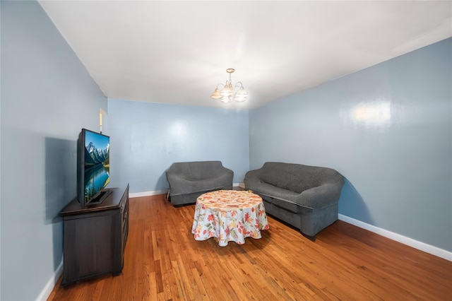 13538 129th St, South Ozone Park, NY 11420 - sitting room featuring a chandelier, wood finished floors, and baseboards
