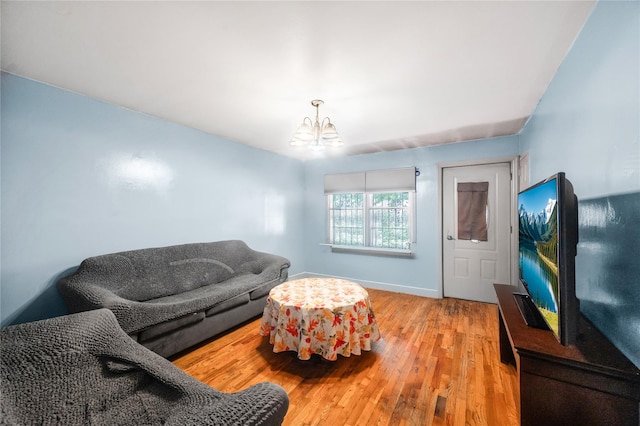 13538 129th St, South Ozone Park, NY 11420 - living area featuring a chandelier, wood finished floors, and baseboards