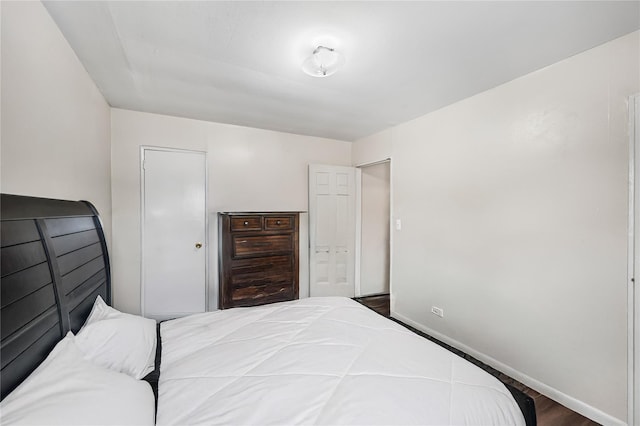 13538 129th St, South Ozone Park, NY 11420 - bedroom featuring baseboards and wood finished floors