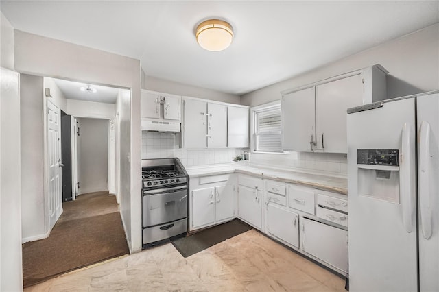 13538 129th St, South Ozone Park, NY 11420 - kitchen with white fridge with ice dispenser, gas range, under cabinet range hood, light countertops, and tasteful backsplash