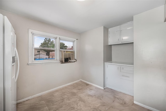 13538 129th St, South Ozone Park, NY 11420 - unfurnished dining area with baseboards and cooling unit