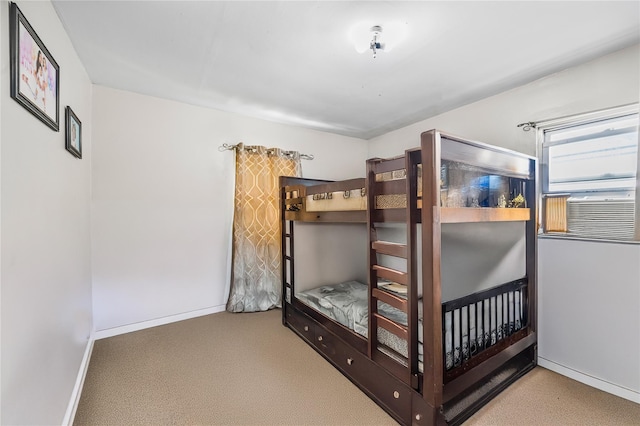 13538 129th St, South Ozone Park, NY 11420 - bedroom with baseboards, carpet floors, and cooling unit