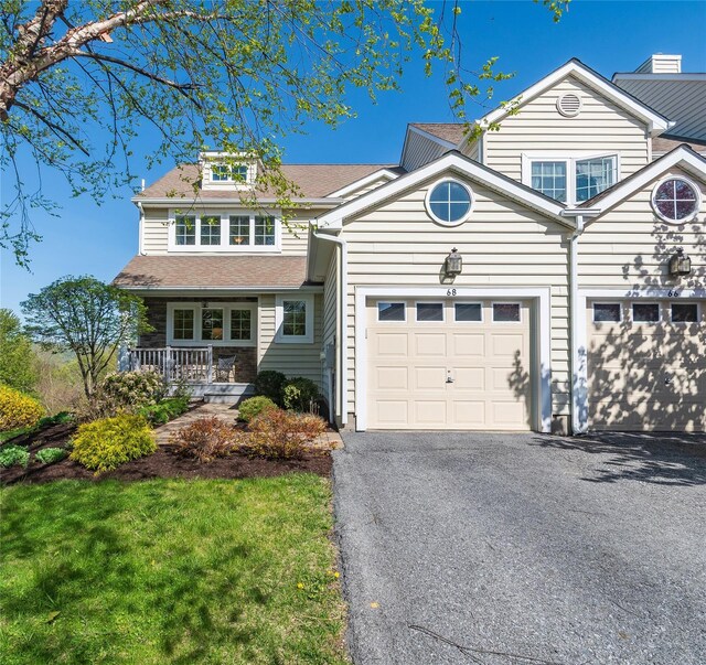 68 Hudson View Ter, Hyde Park, NY 12538 - view of front of home with driveway, a porch, a garage, and a shingled roof