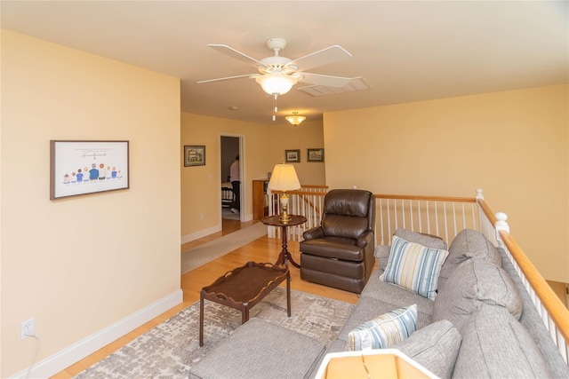 68 Hudson View Ter, Hyde Park, NY 12538 - living area with wood finished floors, a ceiling fan, and baseboards