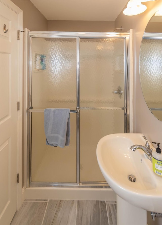 68 Hudson View Ter, Hyde Park, NY 12538 - bathroom featuring a shower stall and wood finished floors
