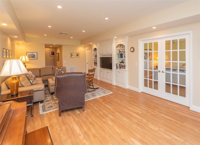 68 Hudson View Ter, Hyde Park, NY 12538 - living area featuring light wood finished floors, recessed lighting, and french doors