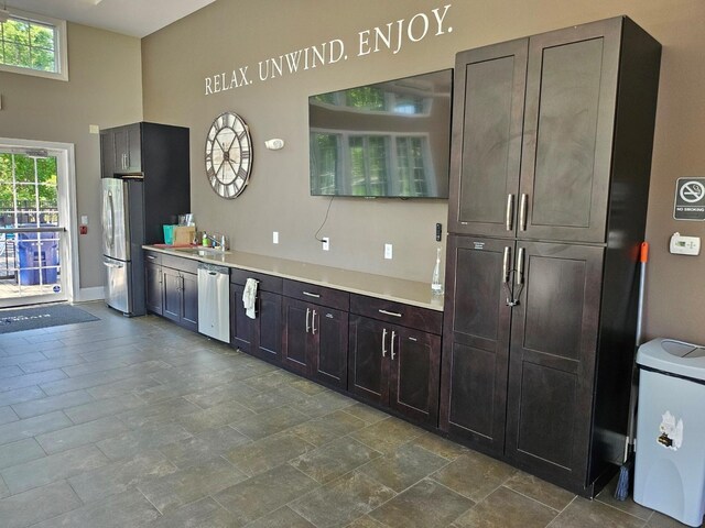 68 Hudson View Ter, Hyde Park, NY 12538 - kitchen featuring stainless steel appliances, light countertops, plenty of natural light, a sink, and a towering ceiling