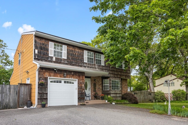 60 Heston Rd, Shirley, NY 11967 - view of front facade featuring driveway and a garage