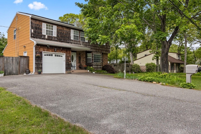 60 Heston Rd, Shirley, NY 11967 - view of front facade with an attached garage and asphalt driveway