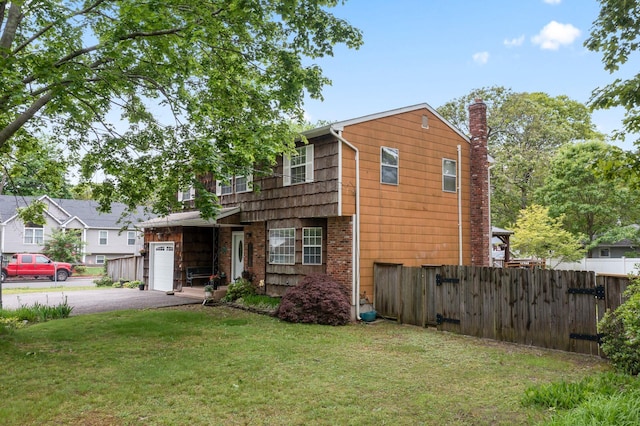 60 Heston Rd, Shirley, NY 11967 - view of front of home with driveway and a chimney