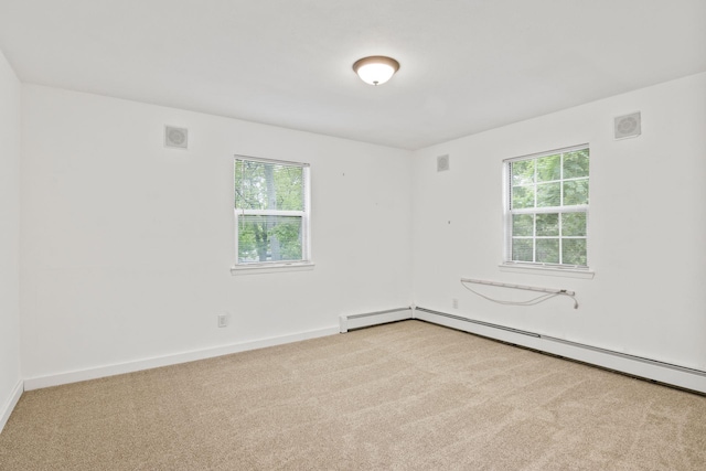 60 Heston Rd, Shirley, NY 11967 - spare room featuring healthy amount of natural light, carpet flooring, baseboards, and baseboard heating