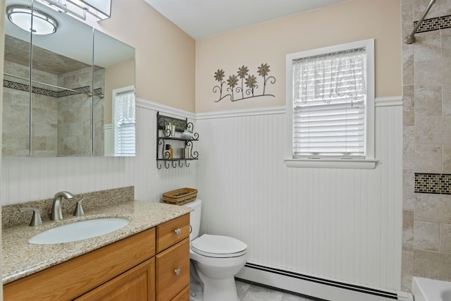60 Heston Rd, Shirley, NY 11967 - bathroom with a baseboard heating unit, a wainscoted wall, vanity, toilet, and tile patterned flooring