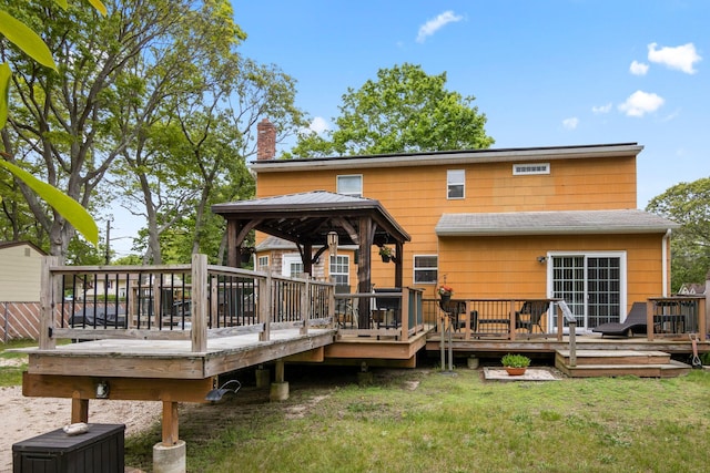 60 Heston Rd, Shirley, NY 11967 - rear view of house with a gazebo, a chimney, a lawn, and a deck