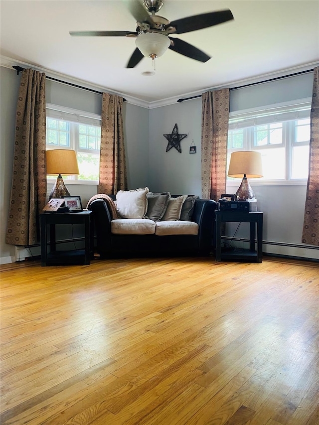 24 Lowerre St, Babylon, NY 11702 - living area with wood finished floors, crown molding, and ceiling fan