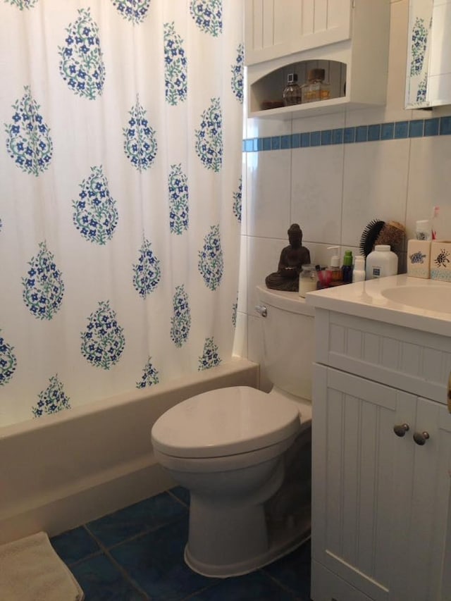 24 Lowerre St, Babylon, NY 11702 - full bath with vanity, toilet, shower / bath combo with shower curtain, tile patterned floors, and tile walls