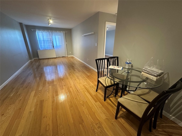87-30 62nd Ave Unit 5-E, Rego Park, NY 11374 - dining space featuring light wood-type flooring and baseboards