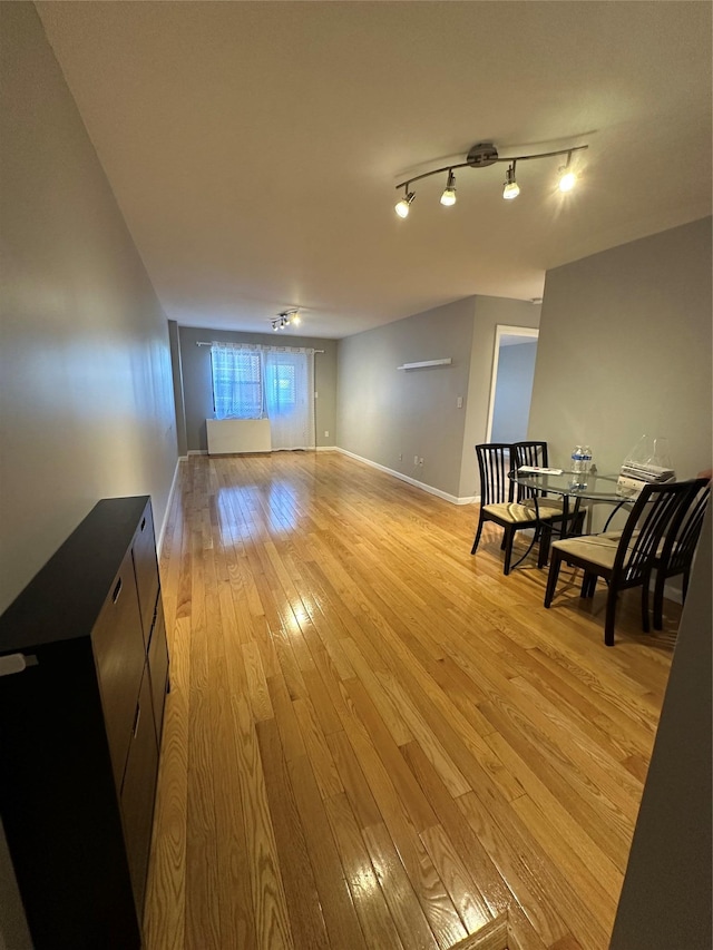 87-30 62nd Ave Unit 5-E, Rego Park, NY 11374 - living area featuring light wood-type flooring and baseboards