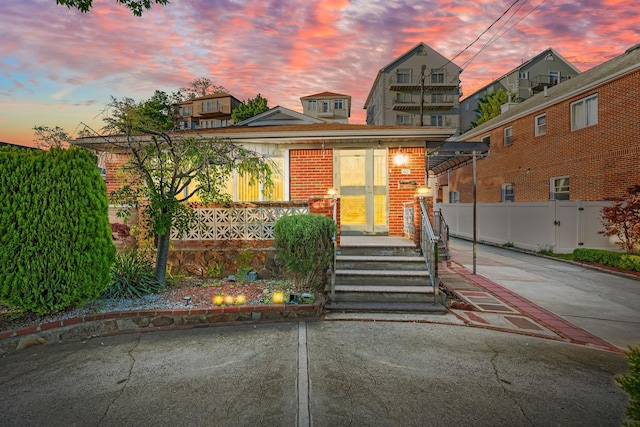 669 W Fingerboard Rd, Staten Island, NY 10305 - view of front of home with brick siding and a porch