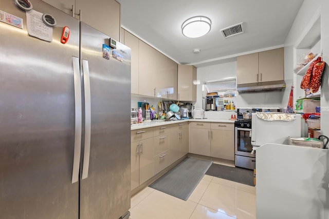 669 W Fingerboard Rd, Staten Island, NY 10305 - kitchen featuring stainless steel appliances, under cabinet range hood, light countertops, and light tile patterned flooring