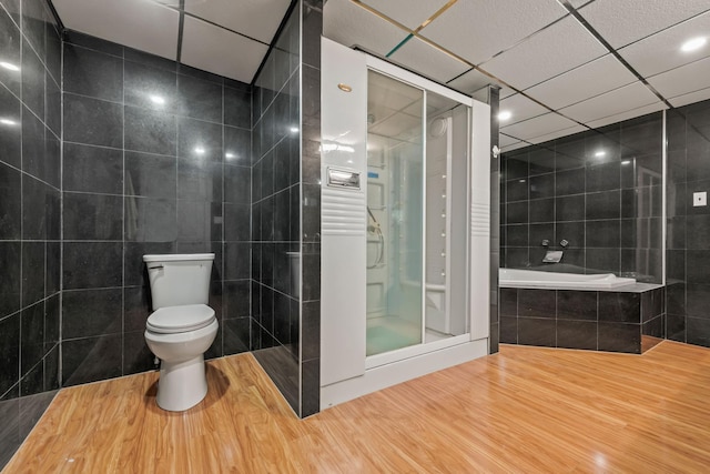 669 W Fingerboard Rd, Staten Island, NY 10305 - full bathroom with tile walls, toilet, a stall shower, and a bath