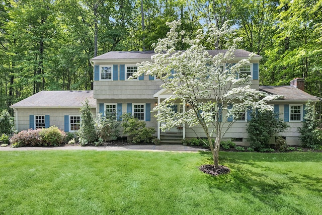 10 Catherine Pl, Katonah, NY 10536 - view of front facade featuring a front yard and roof with shingles