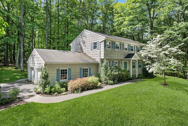 10 Catherine Pl, Katonah, NY 10536 - colonial inspired home with roof with shingles, a front yard, an attached garage, and driveway