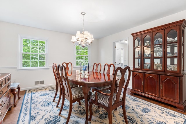 10 Catherine Pl, Katonah, NY 10536 - dining room featuring a chandelier, baseboards, and light wood-type flooring