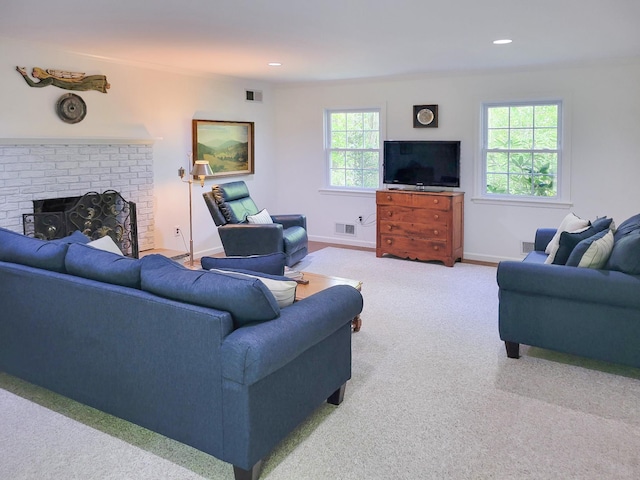 10 Catherine Pl, Katonah, NY 10536 - living room with carpet, a brick fireplace, baseboards, and recessed lighting