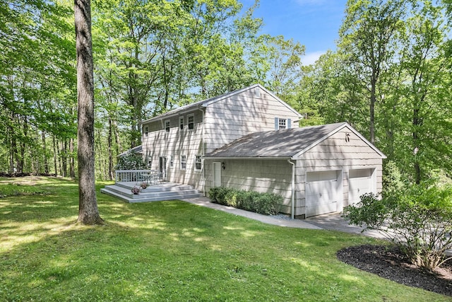 10 Catherine Pl, Katonah, NY 10536 - back of house with a garage and a lawn