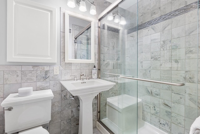 10 Catherine Pl, Katonah, NY 10536 - bathroom featuring toilet, tile walls, and a shower stall