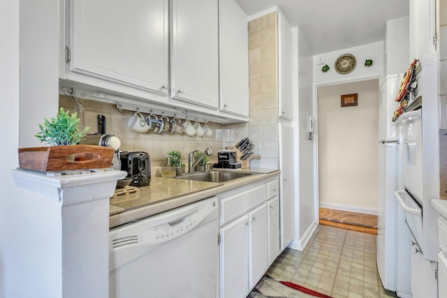 6636 Yellowstone Blvd # 6E, Forest Hills, NY 11375 - kitchen with dishwasher, a sink, white cabinets, light countertops, and backsplash