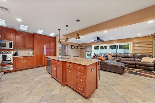 20 Skipper Dr, West Islip, NY 11795 - kitchen with stainless steel appliances, a sink, decorative light fixtures, a warming drawer, and ceiling fan