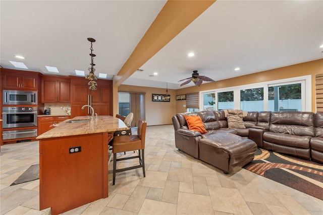 20 Skipper Dr, West Islip, NY 11795 - living room with recessed lighting, healthy amount of natural light, stone tile floors, and a ceiling fan