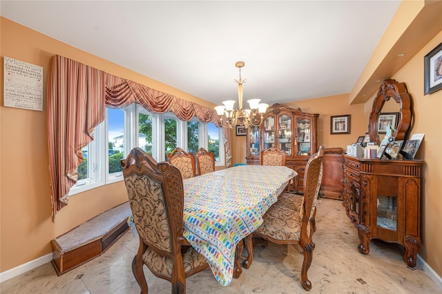 20 Skipper Dr, West Islip, NY 11795 - dining space featuring baseboards and a chandelier
