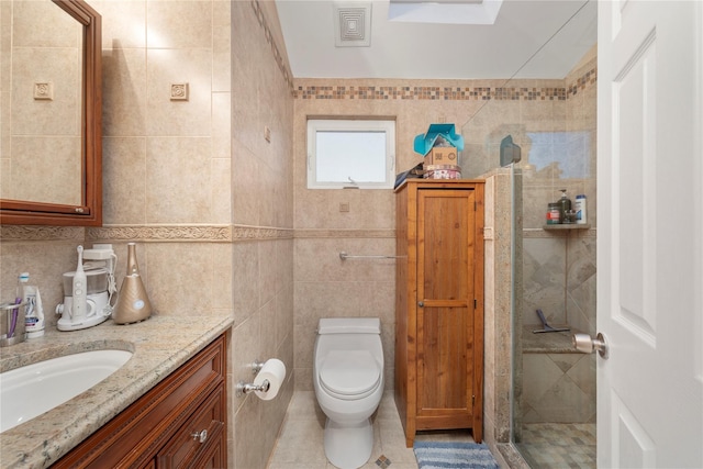 20 Skipper Dr, West Islip, NY 11795 - full bathroom with tile walls, a tile shower, vanity, toilet, and tile patterned flooring