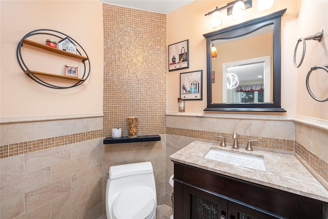 20 Skipper Dr, West Islip, NY 11795 - bathroom with tile walls, toilet, vanity, and wainscoting