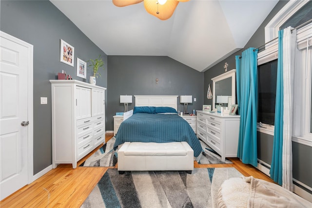 20 Skipper Dr, West Islip, NY 11795 - bedroom featuring light wood-style floors, ceiling fan, lofted ceiling, baseboards, and baseboard heating