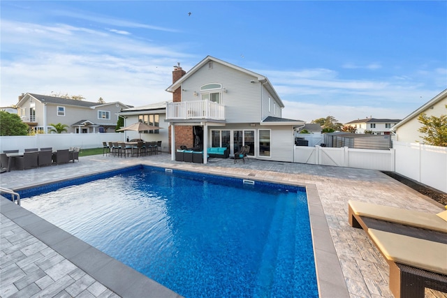 20 Skipper Dr, West Islip, NY 11795 - view of swimming pool featuring an outdoor hangout area, a fenced backyard, a patio, outdoor dining space, and a residential view