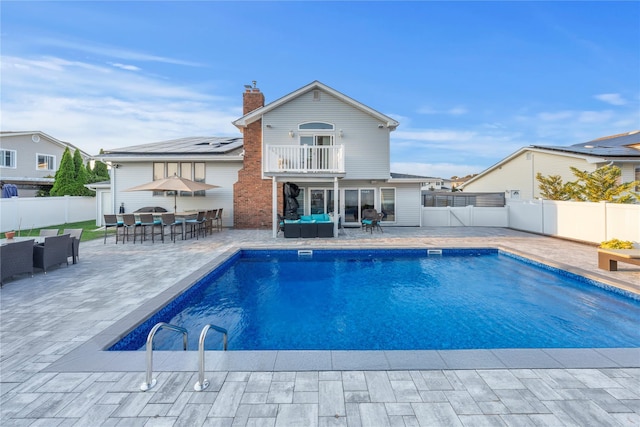 20 Skipper Dr, West Islip, NY 11795 - view of swimming pool featuring outdoor lounge area, outdoor dining space, a fenced backyard, and a patio