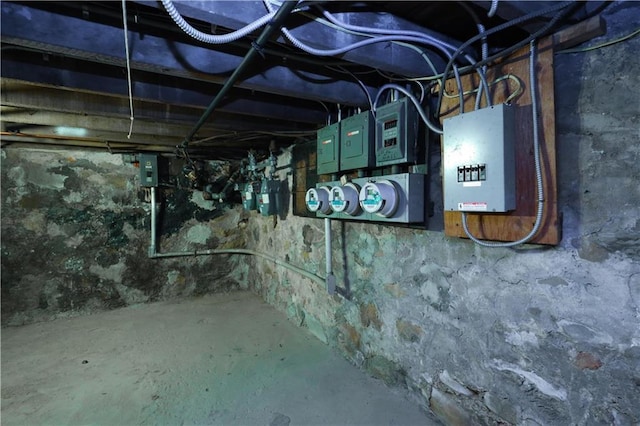 unfinished basement featuring electric panel